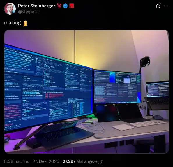 A multi-monitor development setup with code editors open across several screens.